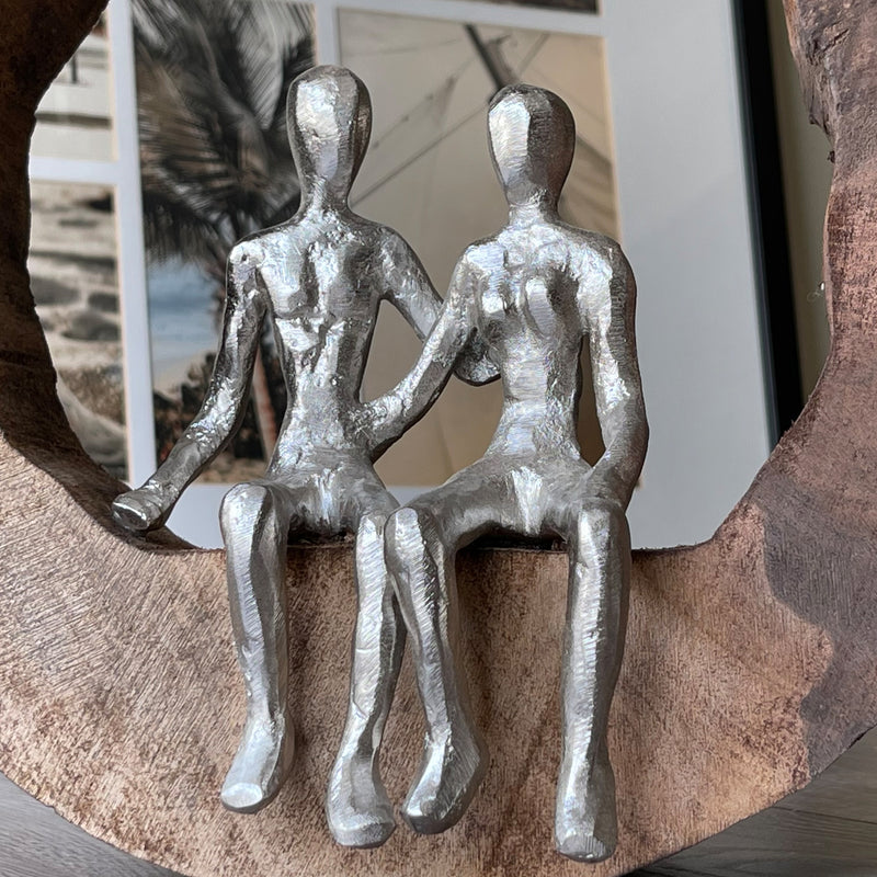 Couple In Love Handmade Decorative Statue In The Middle Up Close Holding Hands